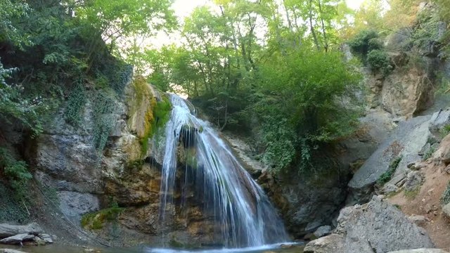 foaming small waterfall in forest