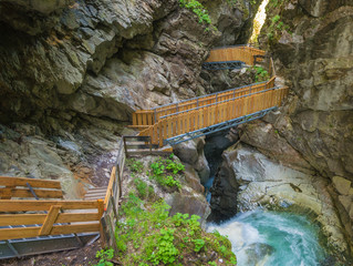 Waterfalls Stanghe (Gilfenklamm) localed near Racines, Bolzano in South Tyrol, Italy. Wooden bridges and runways lead through the canyon and give a spectacular sight to the waterfalls.
