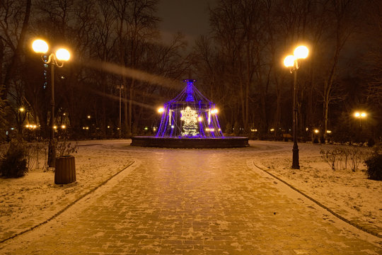 Christmas illuminated decoration of fountain in the Mariinsky Park Kyiv Ukraine. Winter morning view