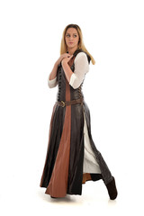 Fototapeta premium full length portrait of girl wearing brown fantasy costume. standing pose on white studio background. 