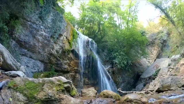 watch a mountain waterfall