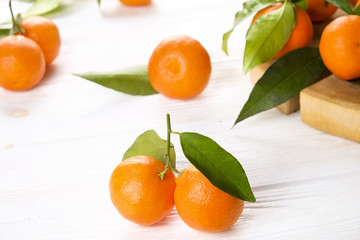 Mandarin Oranges on rustic white wooden background
