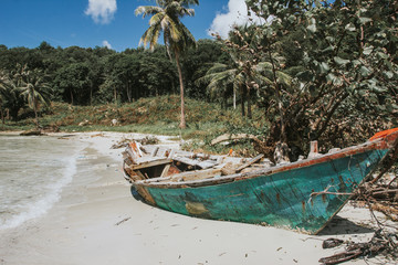 Abandoned fishing boat on a beach.