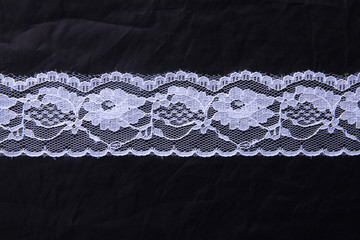 White lace on the black background