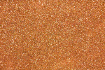 Aerial, top view of gold glitter background