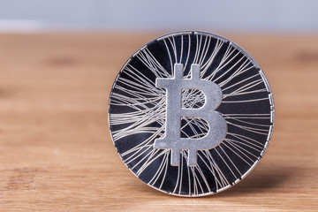 Bitcoin coin on a wooden background. Crypto currency