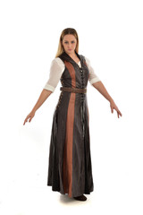 Fototapeta premium full length portrait of girl wearing brown fantasy costume. standing pose on white studio background. 