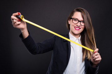 Beautiful young designer holding a yellow roulette