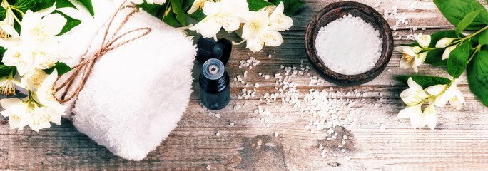 Spa setting with jasmine flowers and essential oil. Wellness concept