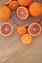 Oranges and Tangerines on wooden background