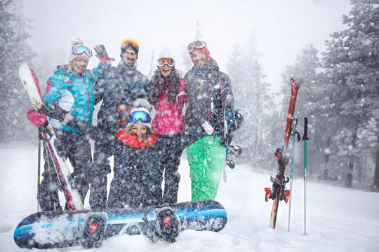 Group skiers in snowy mountain together