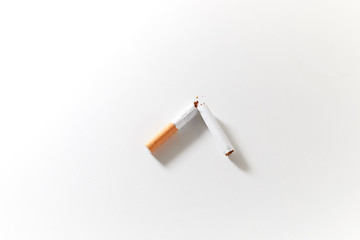 broken cigarette on white background