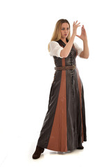 full length portrait of girl wearing brown  fantasy costume. standing pose on white studio background. 