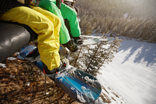 Close up of skiers legs in ski lift, concept