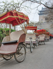Fototapeta na wymiar Rickshaw’s park in the early morning around the famous Bell tower in Beijing, China