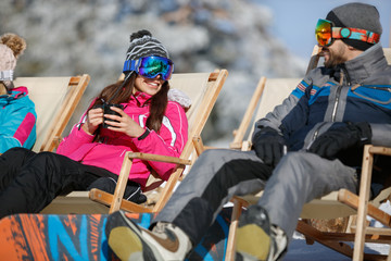 Woman and man on skiing in sunbed