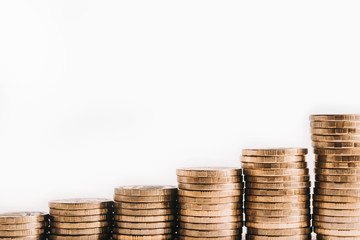 A pile of gold coins, ascending. The growth of finance. Isolated white background.