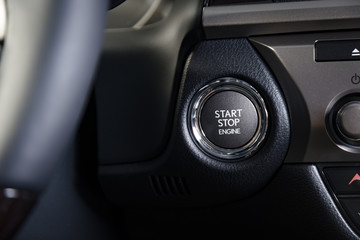 Engine start stop button