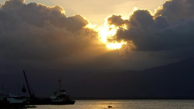 Boats With Dynamic Clouds & Rays Of Light; Around Puerto Princesa; Puerto Princesa, Palawan, Philippines, Asia