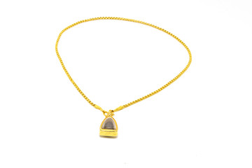 a golden necklace with amulet isolated on white background