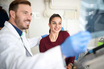 Fototapeta premium Girl in dental clinic with dentist