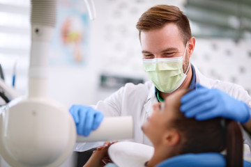 Doctor preparing apparatus for x-ray footage of tooth