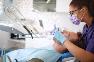 Female dentist working with patients