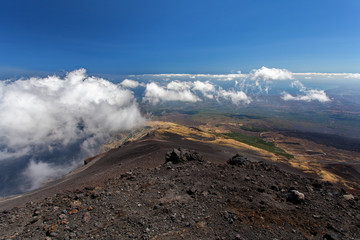 Panoramic view over the clouds from Etna at Mediterranean sea, Sicily, Italy