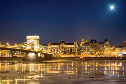 Pest Night View Across Frozen River Under Full Moon, Budapest