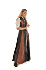 Fototapeta premium full length portrait of girl wearing brown fantasy costume. standing pose on white studio background. 