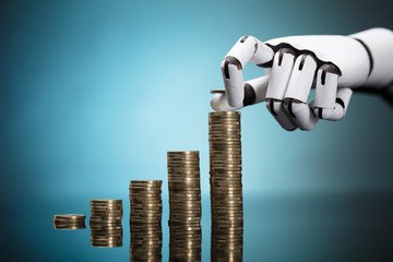 Robot Stacking Coins On Turquoise Background