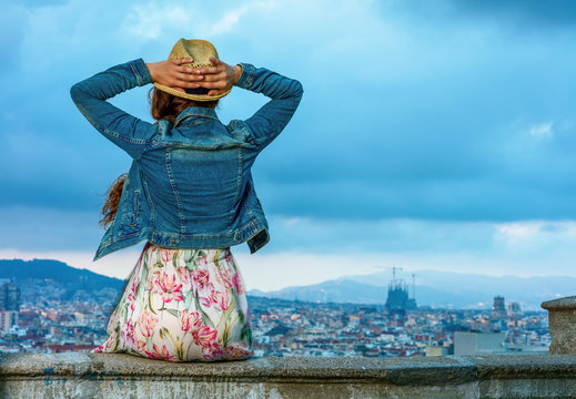 tourist woman in front of city panorama of Barcelona relaxing