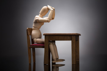 Wooden Dummy Figure Suffering From Headache