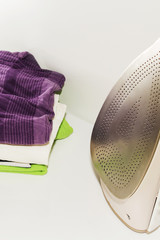clothing beside iron prepared for Ironing