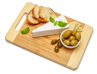 brie or camambert cheese and olives on a white background