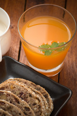 orange juice with bread fruit and milk