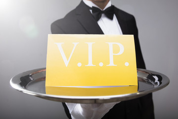 Waiter Showing Vip Text On Banner