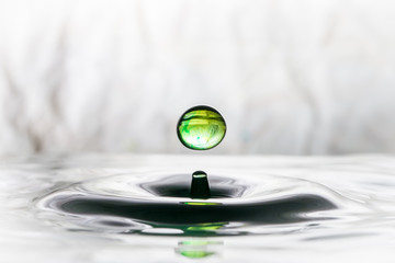 Green water drop bouncing