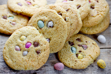Easter egg cookies - homemade big soft american biscuits with chocolate candy mini eggs, sweet easter treats