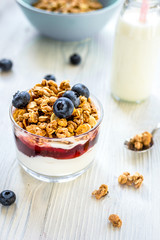 Healthy morning with granola breakfast on white kitchen table