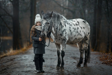 Young girl portrait with Appaloosa horse and Dalmatian dogs 