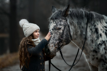 Young girl portrait with Appaloosa horse and Dalmatian dogs 