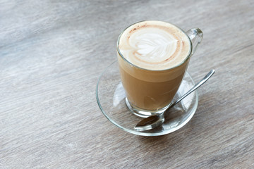 A cup of espresso coffee on wooden table