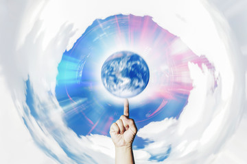 Hand  Spinning earth meaning of manipulation to create power on white clouds circle and shining of...