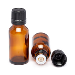 amber color small glass bottle with pin hole dropper and black cap