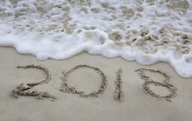 2018 written in the sand with wave