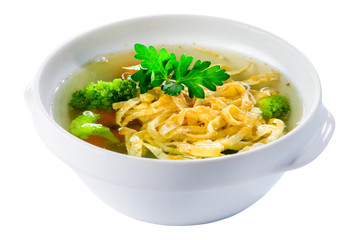 Traditional Italian cuisine. Tasty chicken soup with egg noodles in white plate on light background