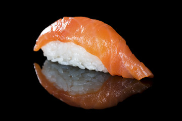 Japanese cuisine. Appetizing salmon and rice on dark background