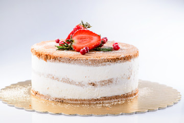 Delicious sweet cake with powdered sugar and strawberries on light background