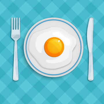 English breakfast with fried eggs, knife and fork on a checkered tablecloth. Good morning